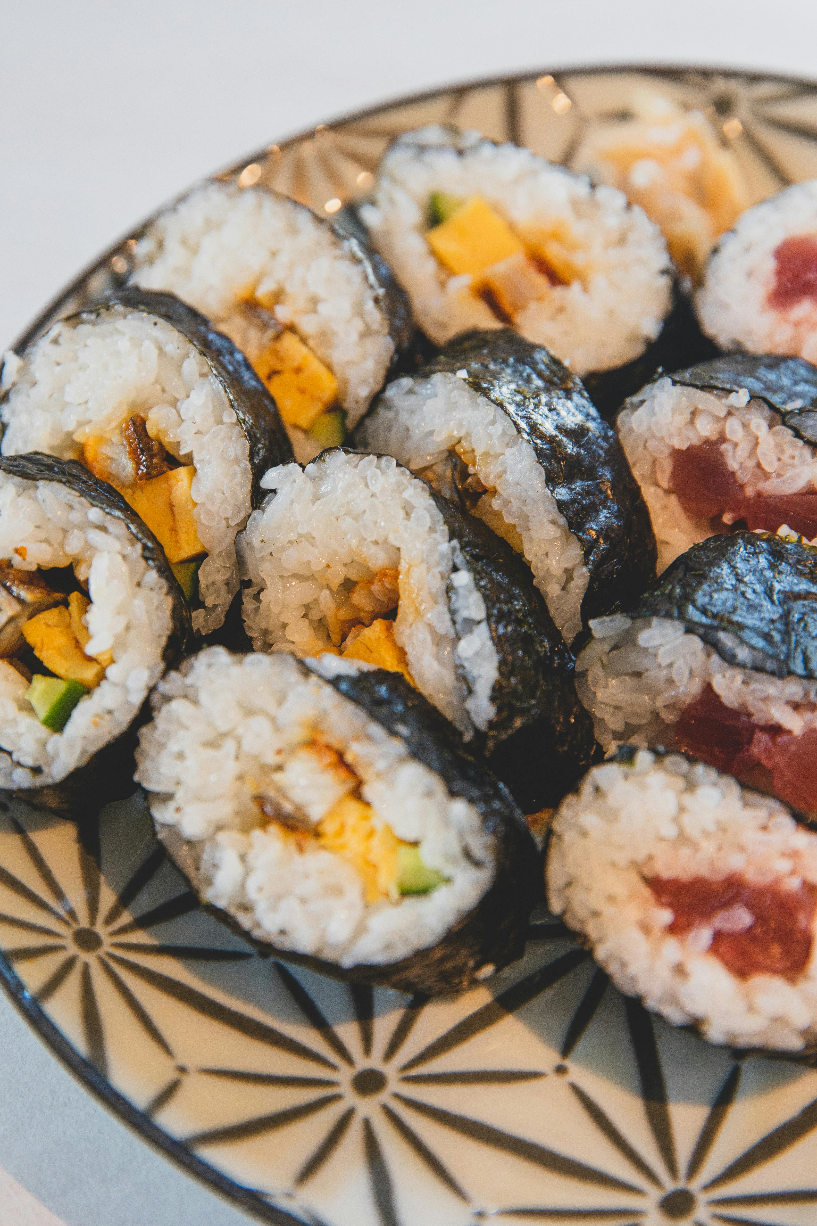 set of tasty sushi on plate