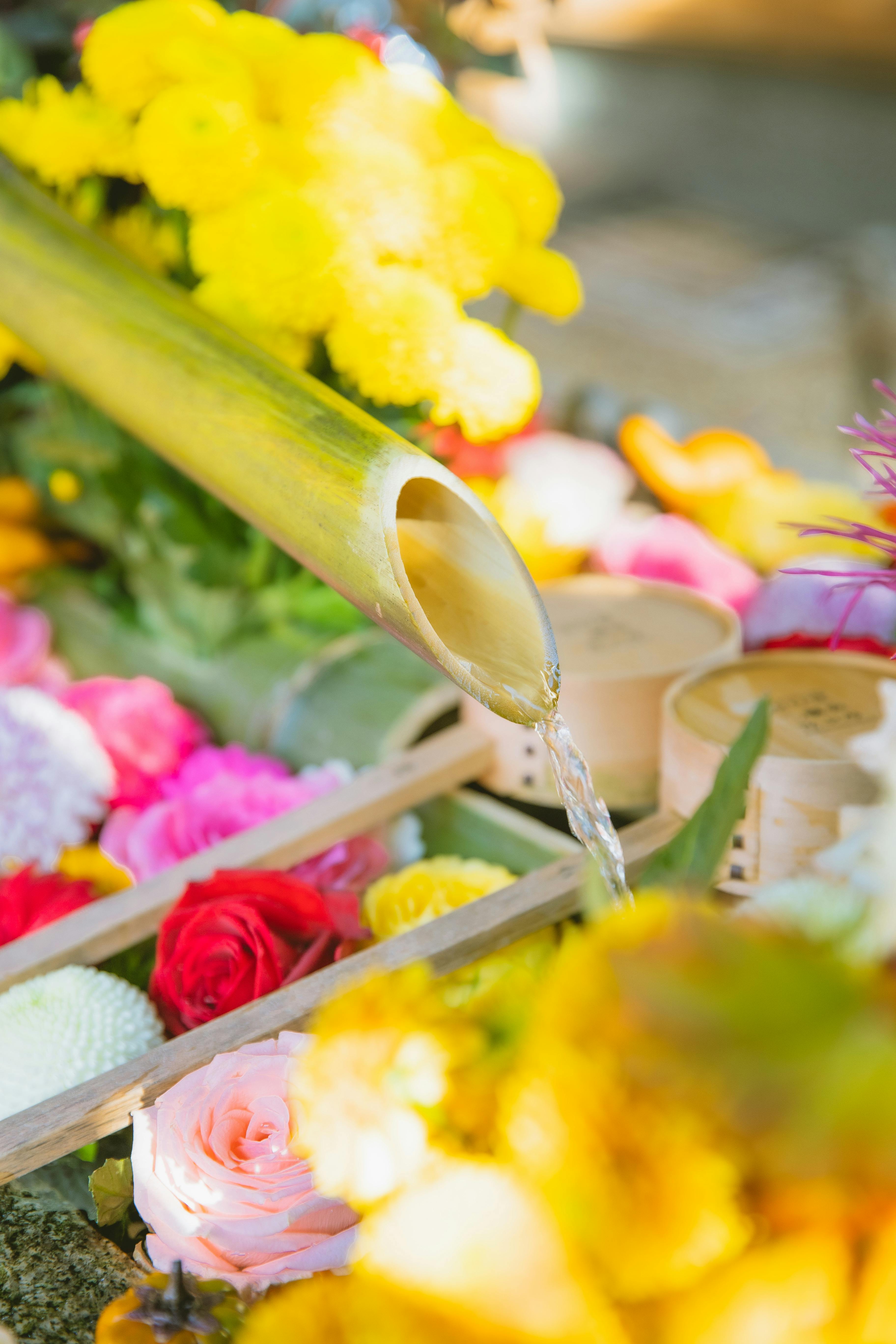 floral decorations with bamboo fountain in garden