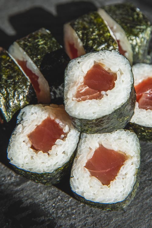 Free Heap of fresh rolls with rice and raw tuna made with traditional Japanese recipe Stock Photo