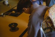 Unrecognizable man in kimono in tea room