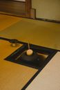 Authentic wooden hishaku used to transfer hot water to chawan placed on tatami in tea room during traditional Japanese ceremony