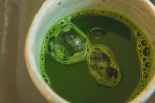 Refreshing iced matcha green tea captured in a cup from above. Perfect for healthy drink lovers.