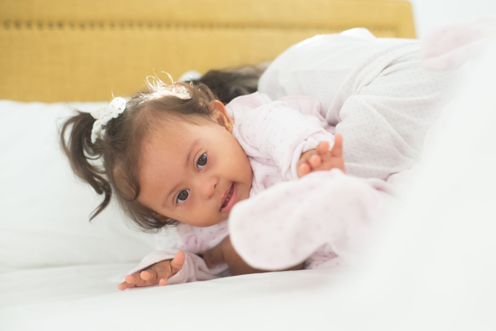 Baby waking up in bed in the morning