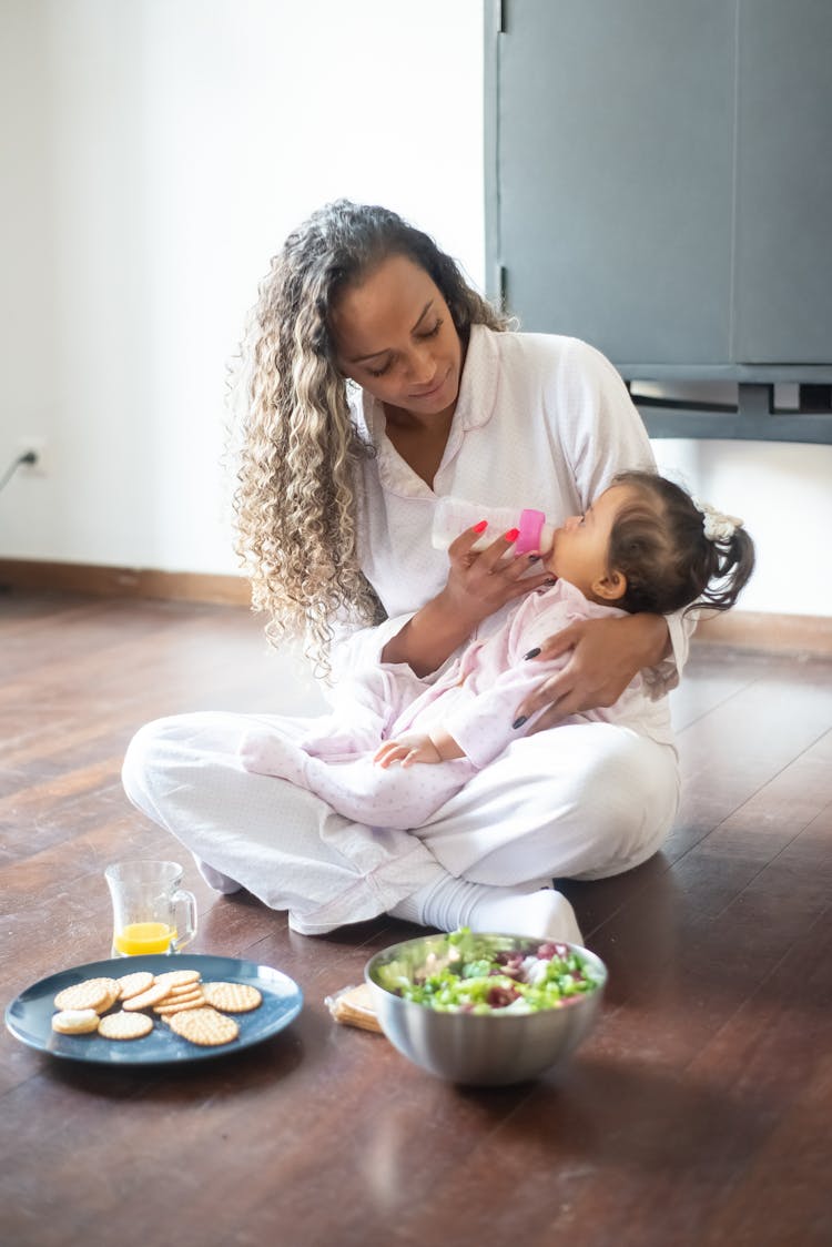 A Mother Feeding Her Daughter