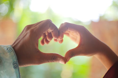 Couple Making Heart Shape using Hands