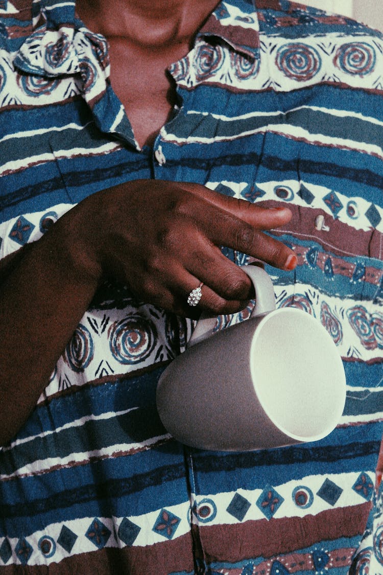 Black Woman Holding Empty Cup In Hand