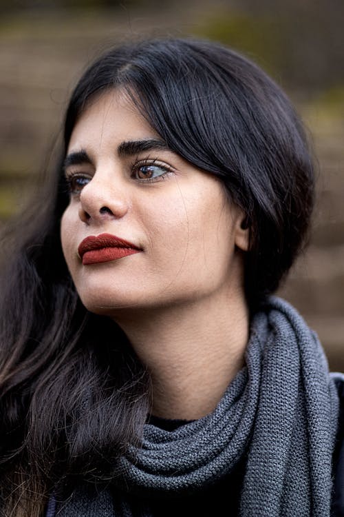 A Close-Up Shot of a Woman Wearing Red Lipstick