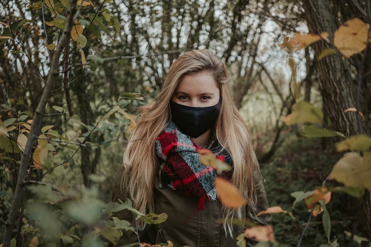 A Woman Wearing Black Face Mask 