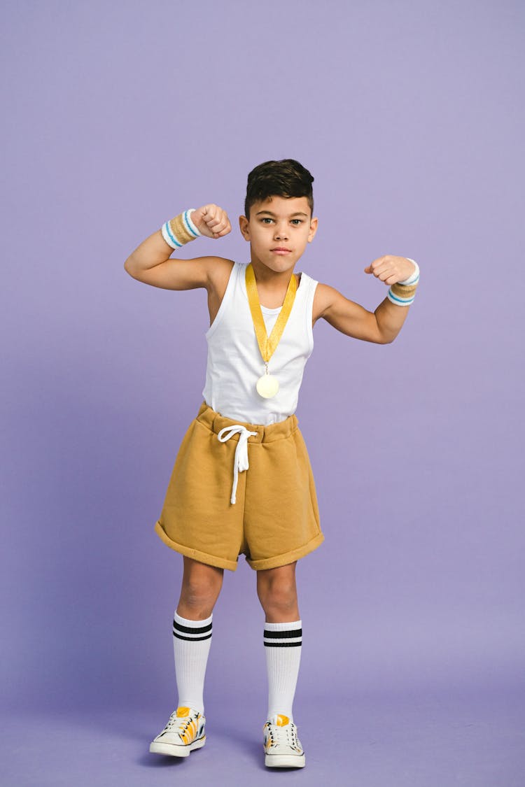 A Boy Wearing A Medal