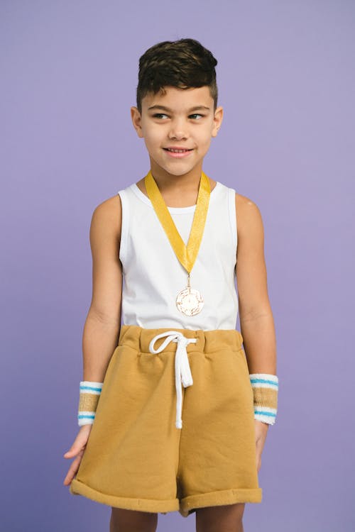 Free A Boy Wearing a Medal Stock Photo