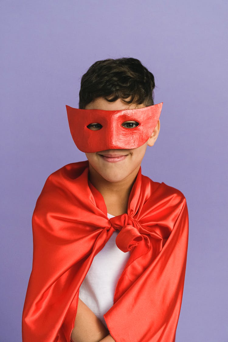 A Boy Wearing A Superhero Costume