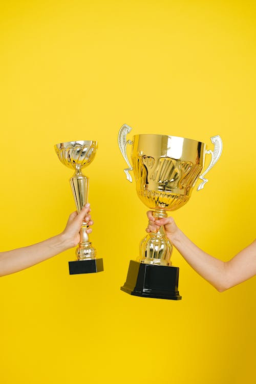 Free People Holding Trophies Stock Photo