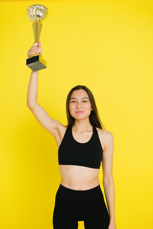 A Woman Holding a Trophy