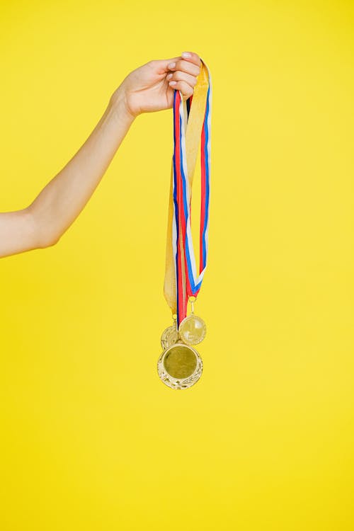 A Person Holding Medals