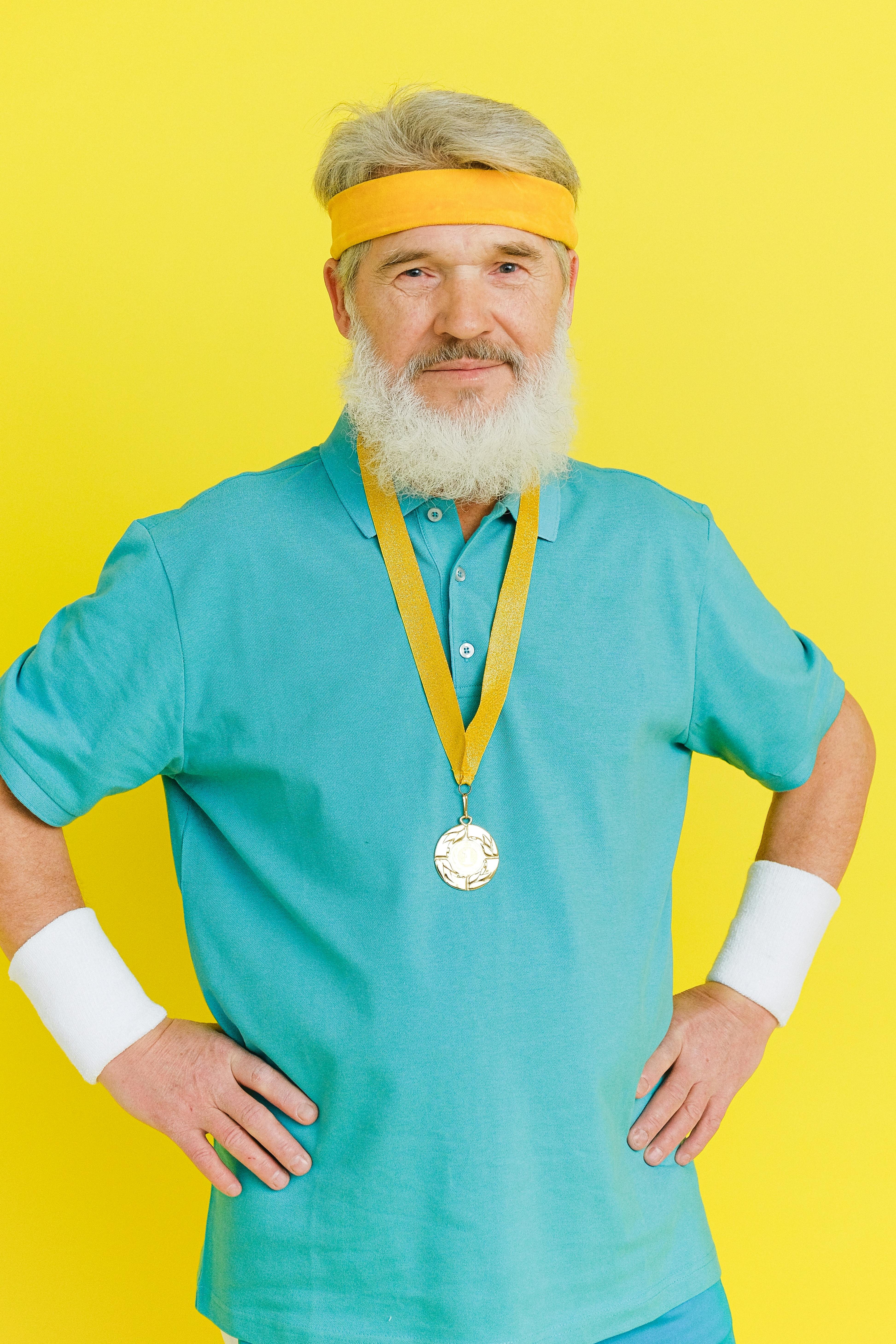 elderly man wearing a gold medal