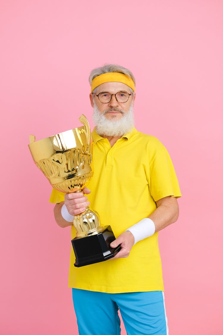 Man Holding A Trophy