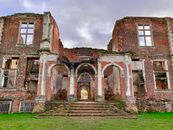 Brown Brick Building Under Cloudy Sky