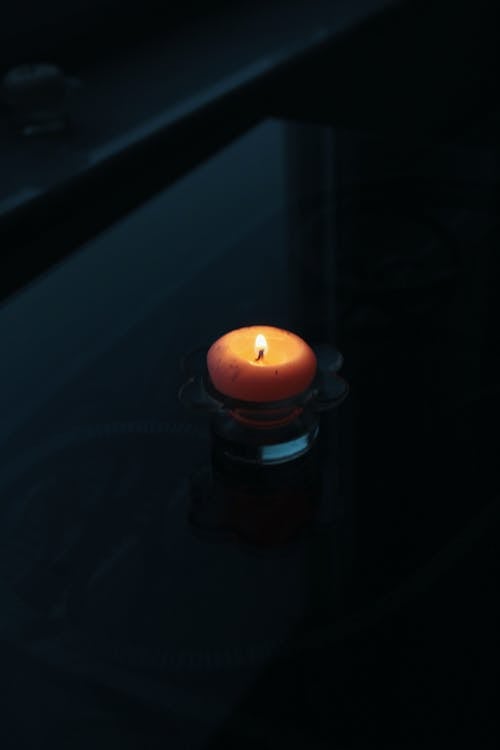 Close-Up Shot of a Lighted Candle