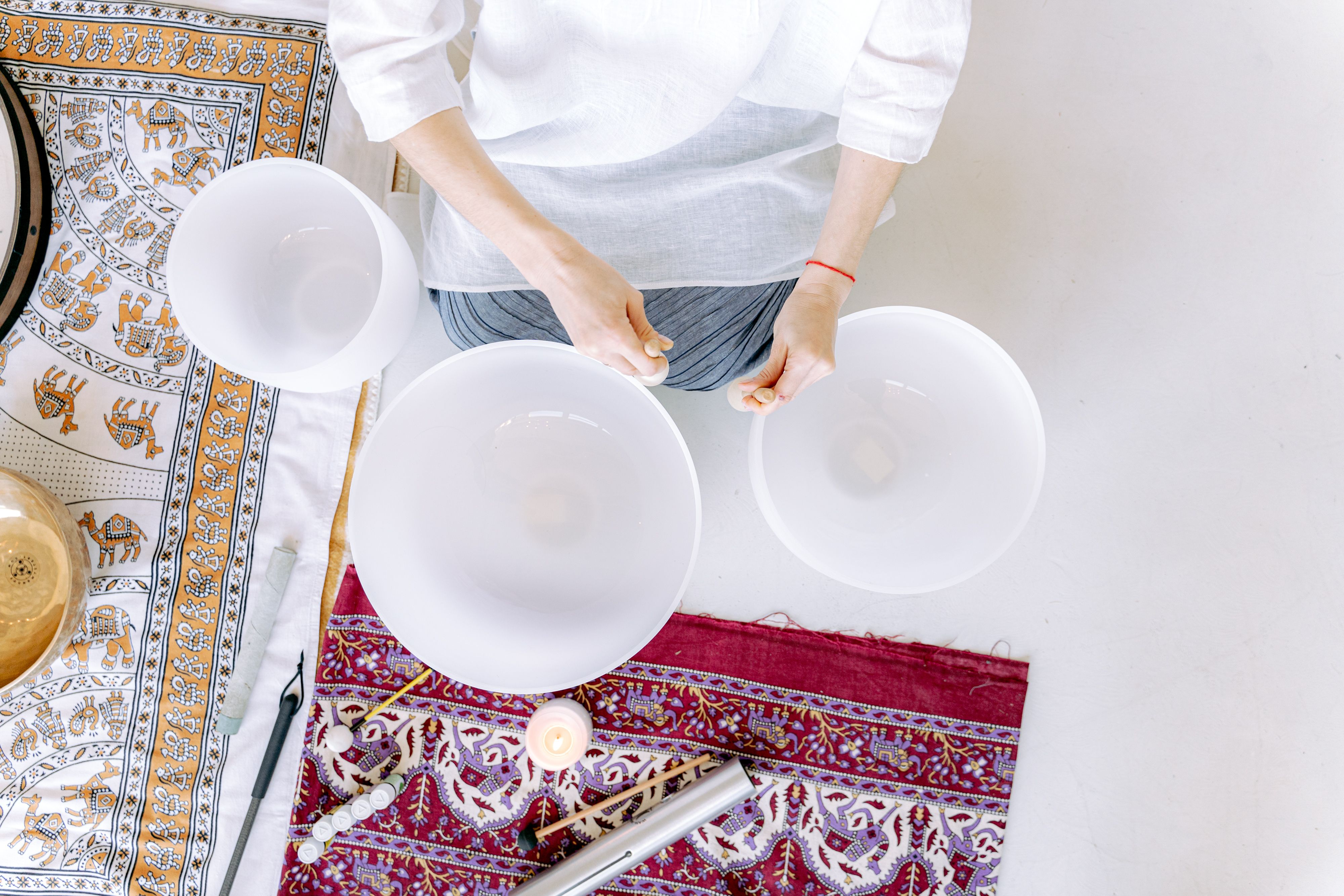 A serene meditation space with crystal singing bowls in natural lighting