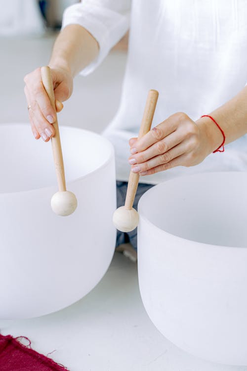 Person Holding Mallets