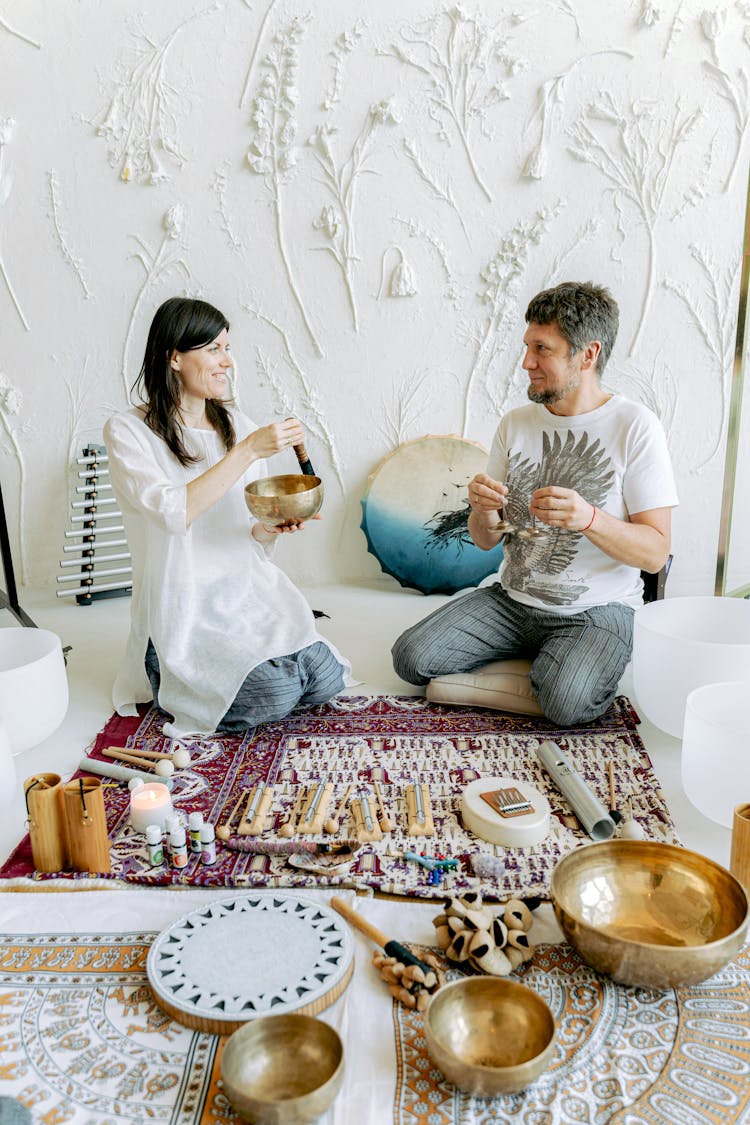 Couple With Ethnic Instruments And Objects