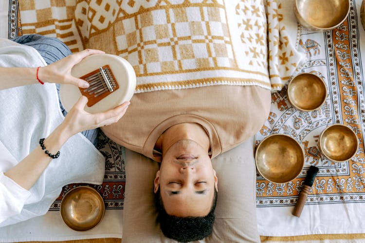 Man Relaxing While Listening To Sounds 