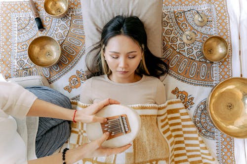 Woman Relaxing while Listening to Sounds