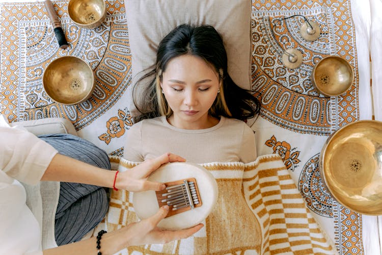 Woman Relaxing While Listening To Sounds