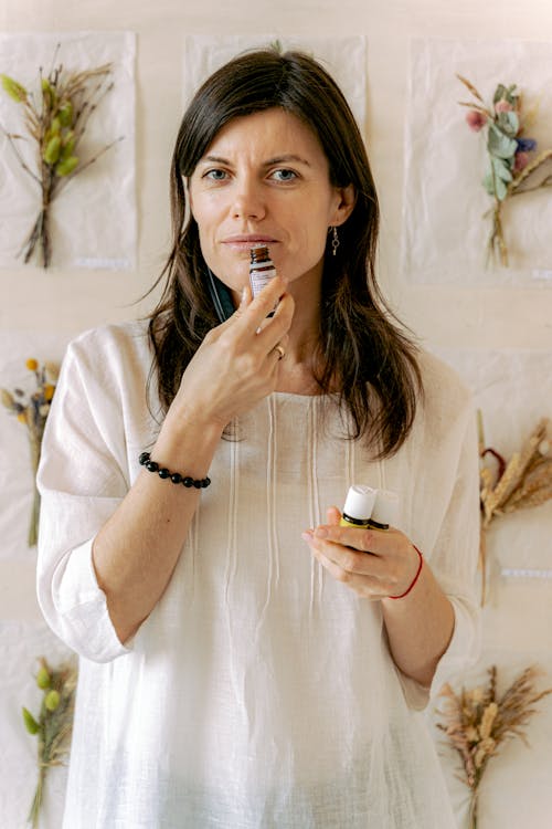 Woman Smelling an Essential Oil