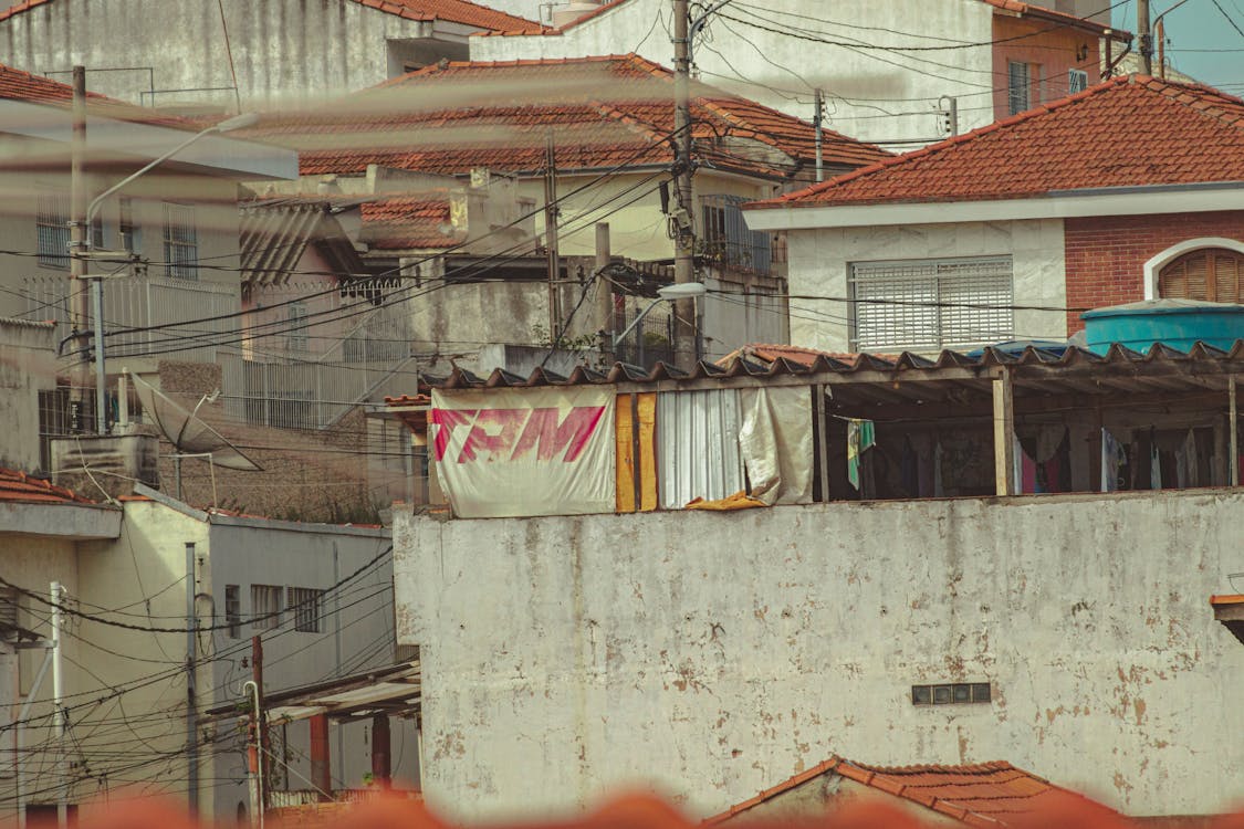 Poor district of slum with shabby houses