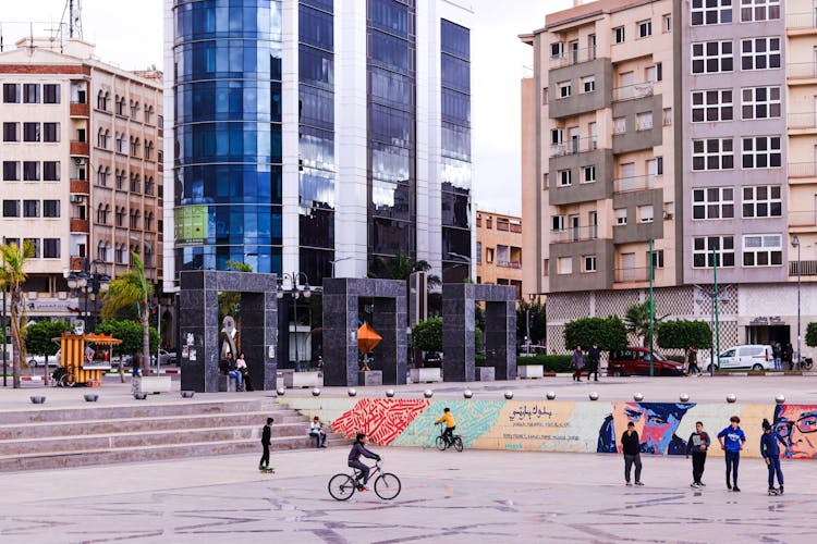 Photograph Of Kids Playing Near Buildings