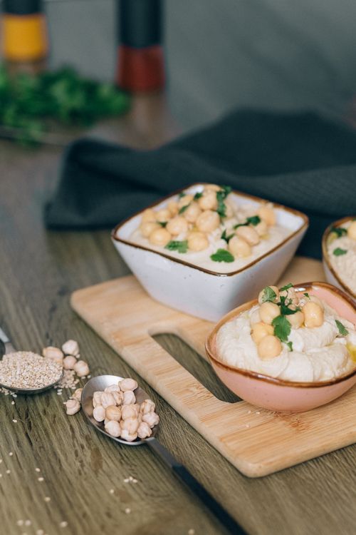 Free A close-up of homemade hummus topped with chickpeas, perfect for a healthy snack. Stock Photo