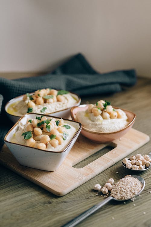 Close-Up Shot of a Hummus on Bowls