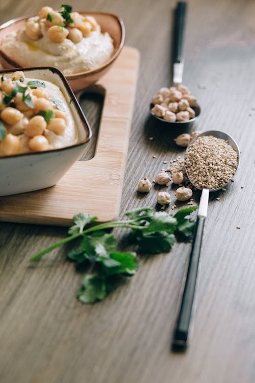 Close-Up Shot of a Hummus on Bowls