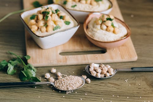 Close-Up Shot of a Hummus on Bowls