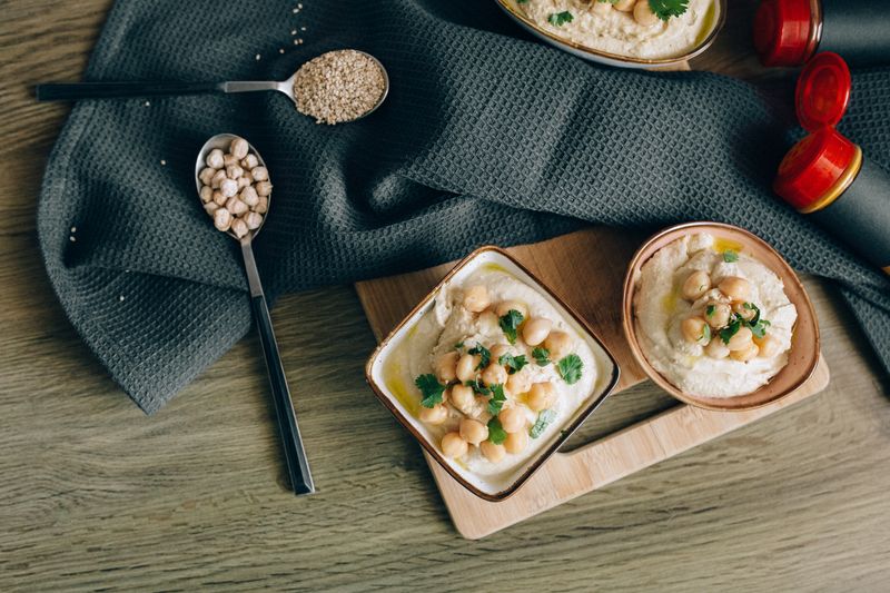 cucumber rounds topped with hummus and a chickpea