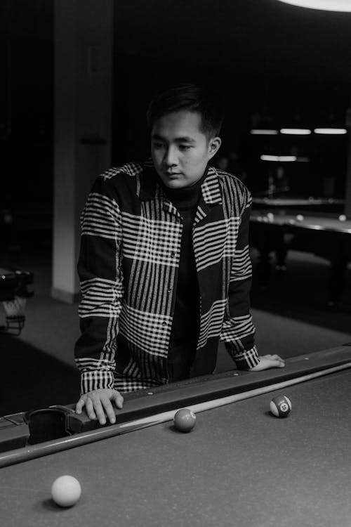 Free Black and White Photo of a Man Standing Near a Pool Table Stock Photo