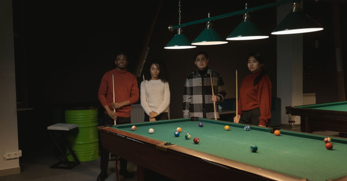 Group Standing Pool Photo of a Group of Friends Standing Near a Pool Table · Free Stock Photo