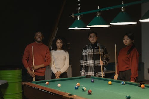 Free Photo of Couples Standing Near a Pool Table Stock Photo