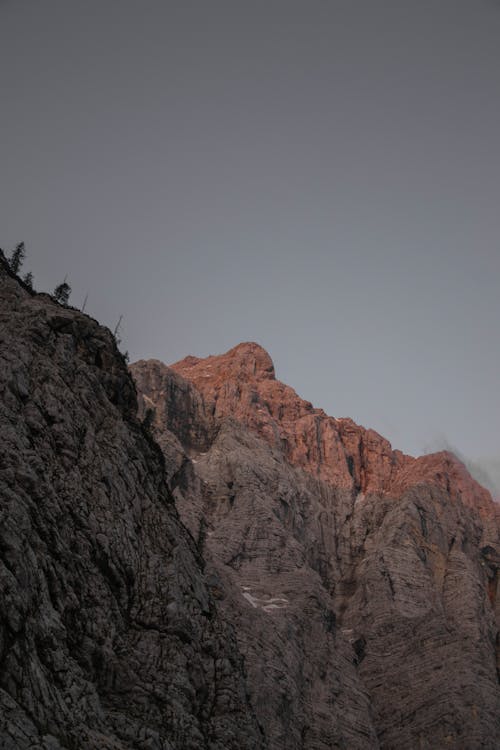 Brown Rocky Mountain Under Gray Sky