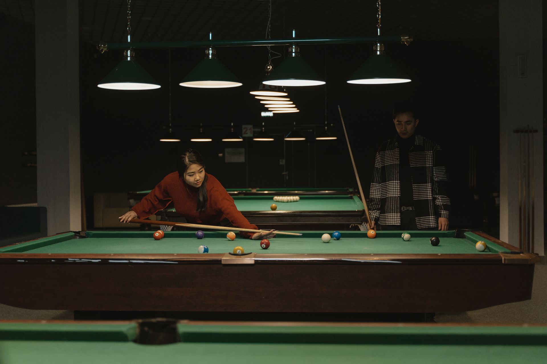 Man and Woman Playing Billiards
