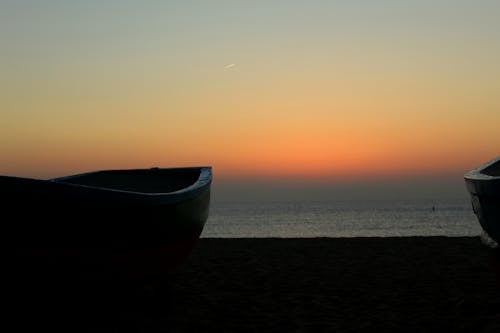 gün doğumu, tekne içeren Ücretsiz stok fotoğraf