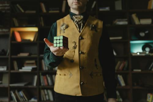 Free Photo of a Rubik's Cube on a Man's Hand Stock Photo