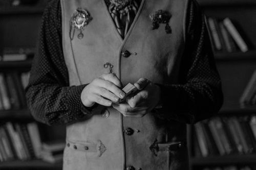 Free A black and white image of hands handling a deck of cards, conveying mystery. Stock Photo