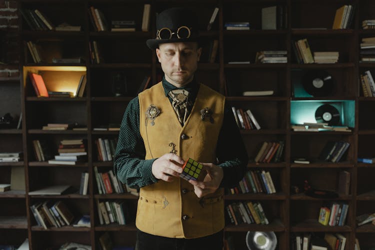 A Man Holding A Rubik's Cube