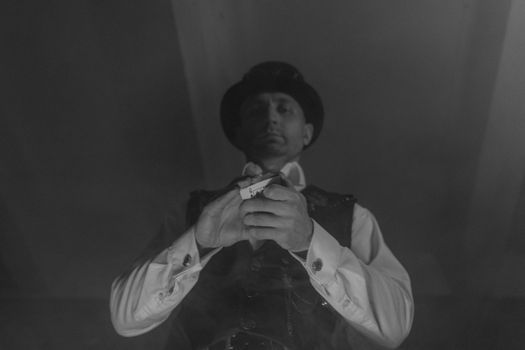 Man Holding Deck of Cards