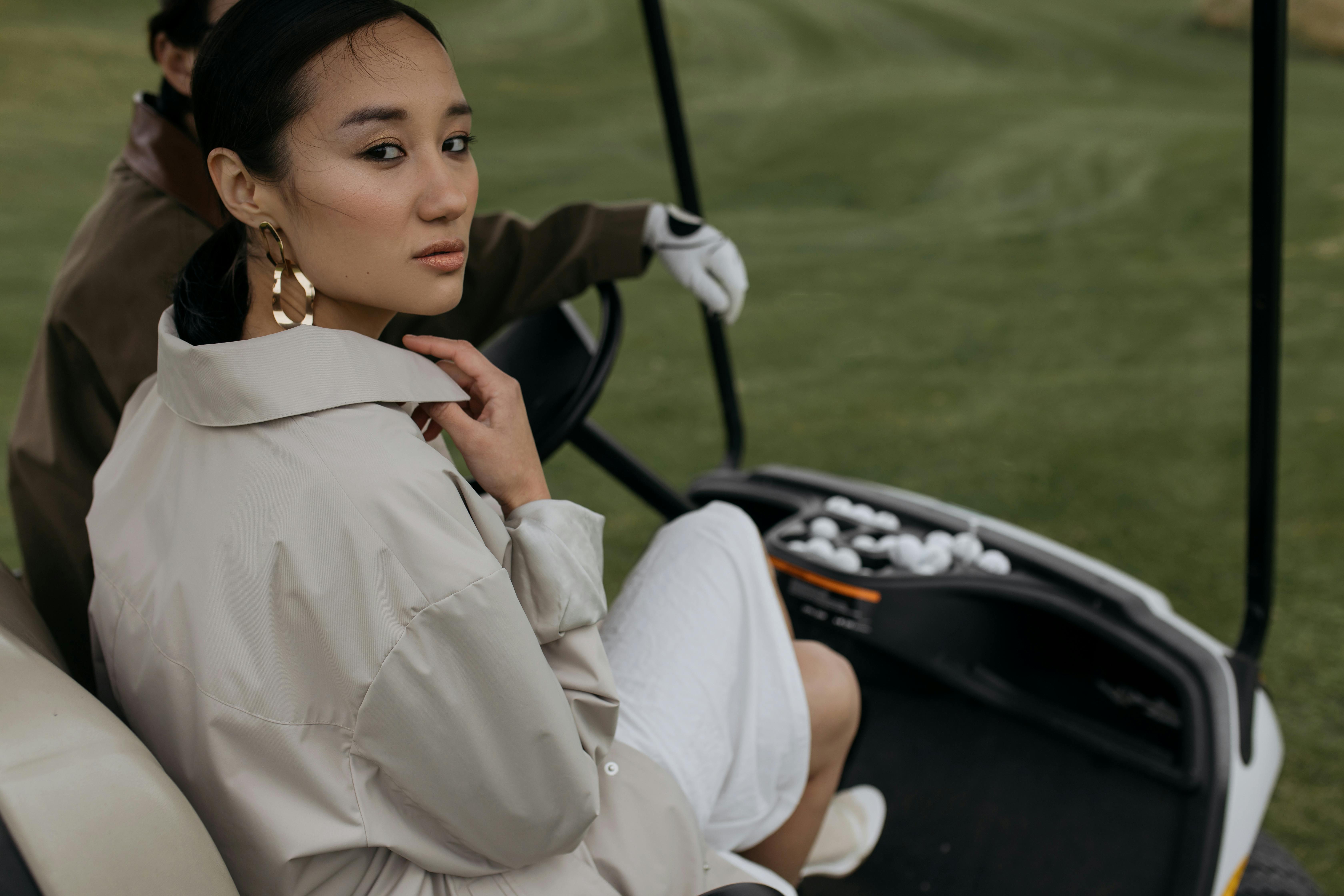 woman sitting in the golf cart