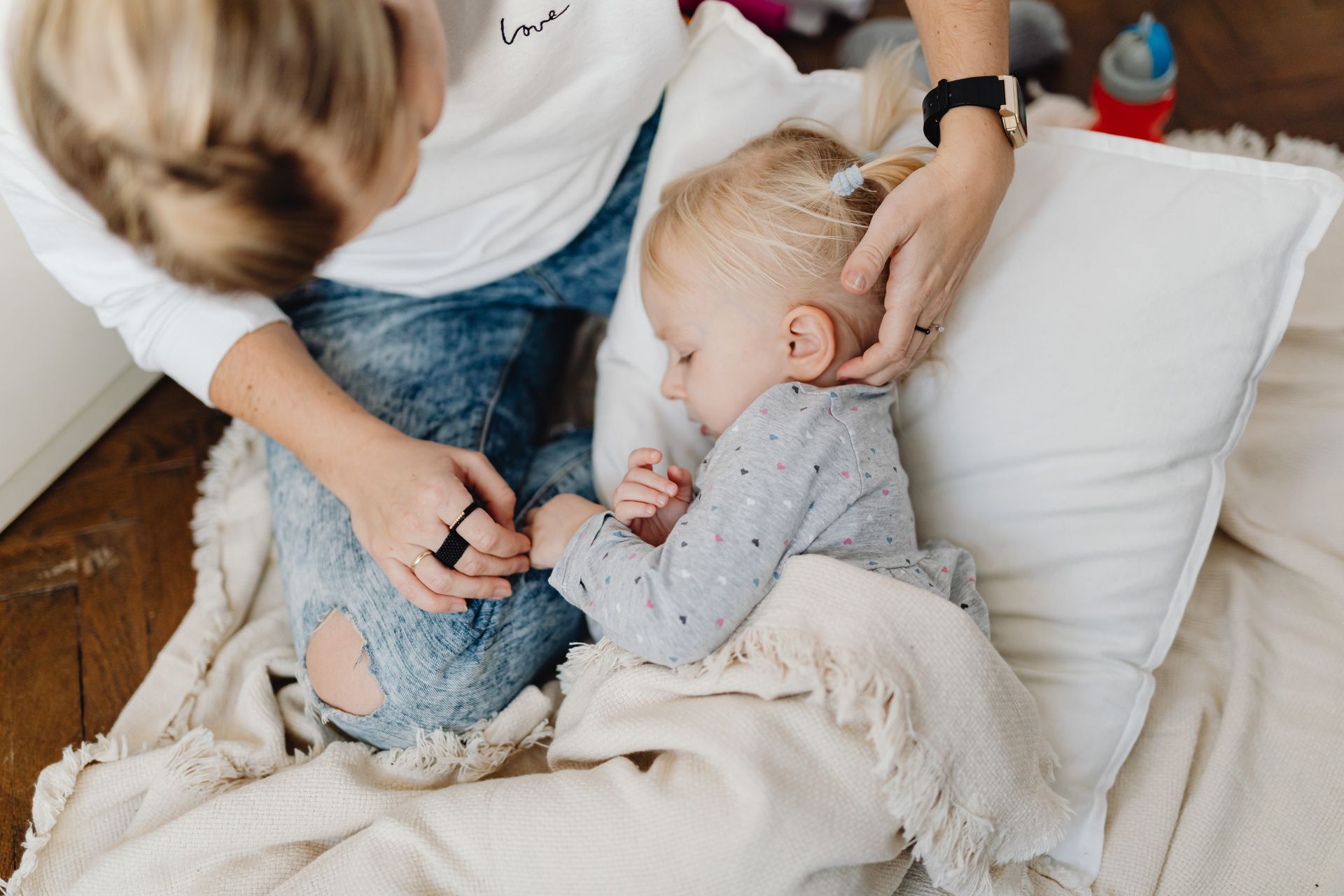 Woman Taking Care for Girl Lying in Bed