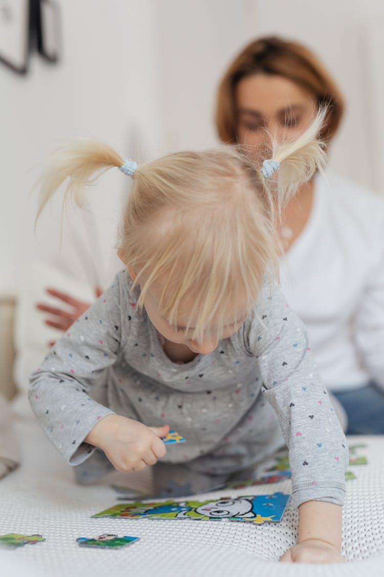 Girl Playing With Puzzles