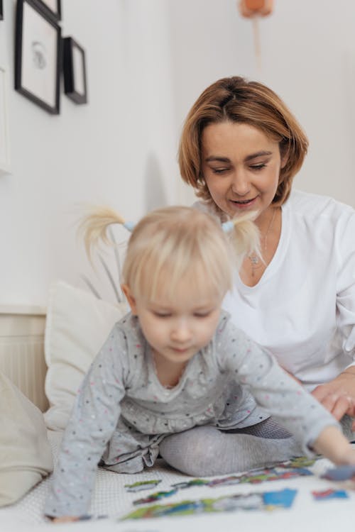 Mother and Daughter Puzzle in Bed